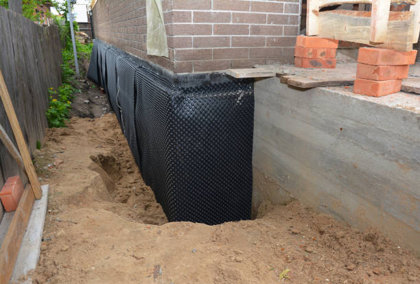Happy homeowners after waterproofing job in Wakeman
